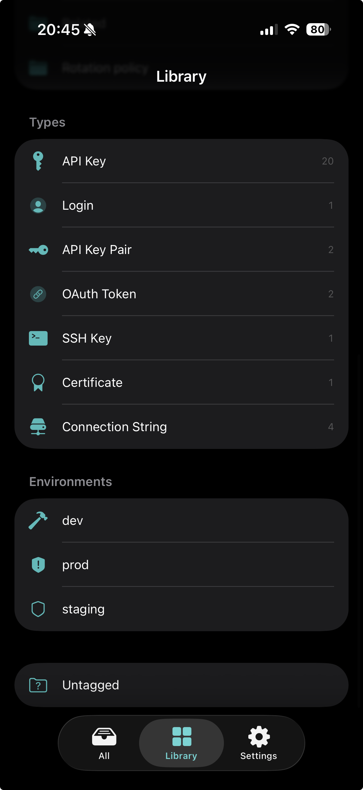 Library tab on iPhone — credential types and environments.
