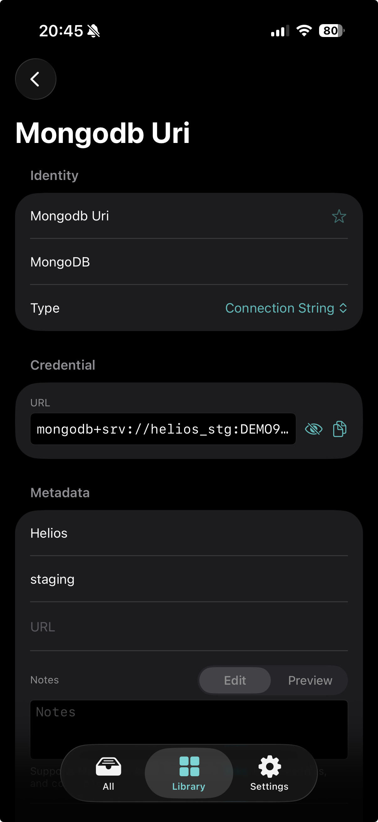 A MongoDB connection-string record open on iPhone.